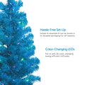 Blue Table Top Tree with Warm White Lights on Left. 2 Feature Call Outs on Right. White Background