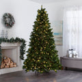 Collins Pine Christmas Tree in Living Room In Front of Fireplace. Fireplace Decorated with Garland and Wreath Above on Wall, Giftboxes to Right of the Tree on Ottoman.