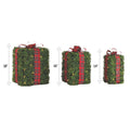 NOMA Pre-Lit Incandescent Winter Garden Gift Boxes - 3-Pack. Vertical Lines Beside Each Box Indicating Height Measurement. White Background.