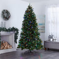Colorado Christmas Tree with Multi-Color Lights, in Living Room In Front of Fireplace. Fireplace Decorated with Garland and Wreath Above on Wall, Giftboxes to Right of the Tree on Ottoman.