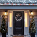 Noma C6 Red & Pure White String Lights, on a roof edge above home entrance. Wreath on door and two potted trees on porch