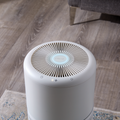 Aerial view of large air-purifier in a home environment - indicator ring blue